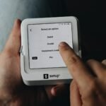 A person is holding a tablet in their hands